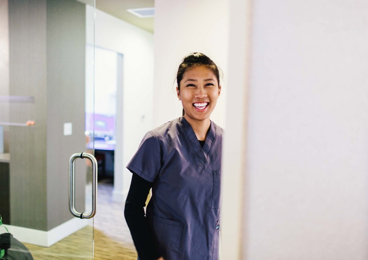 A friendly Beavercreek Dental team member welcoming patients at the office